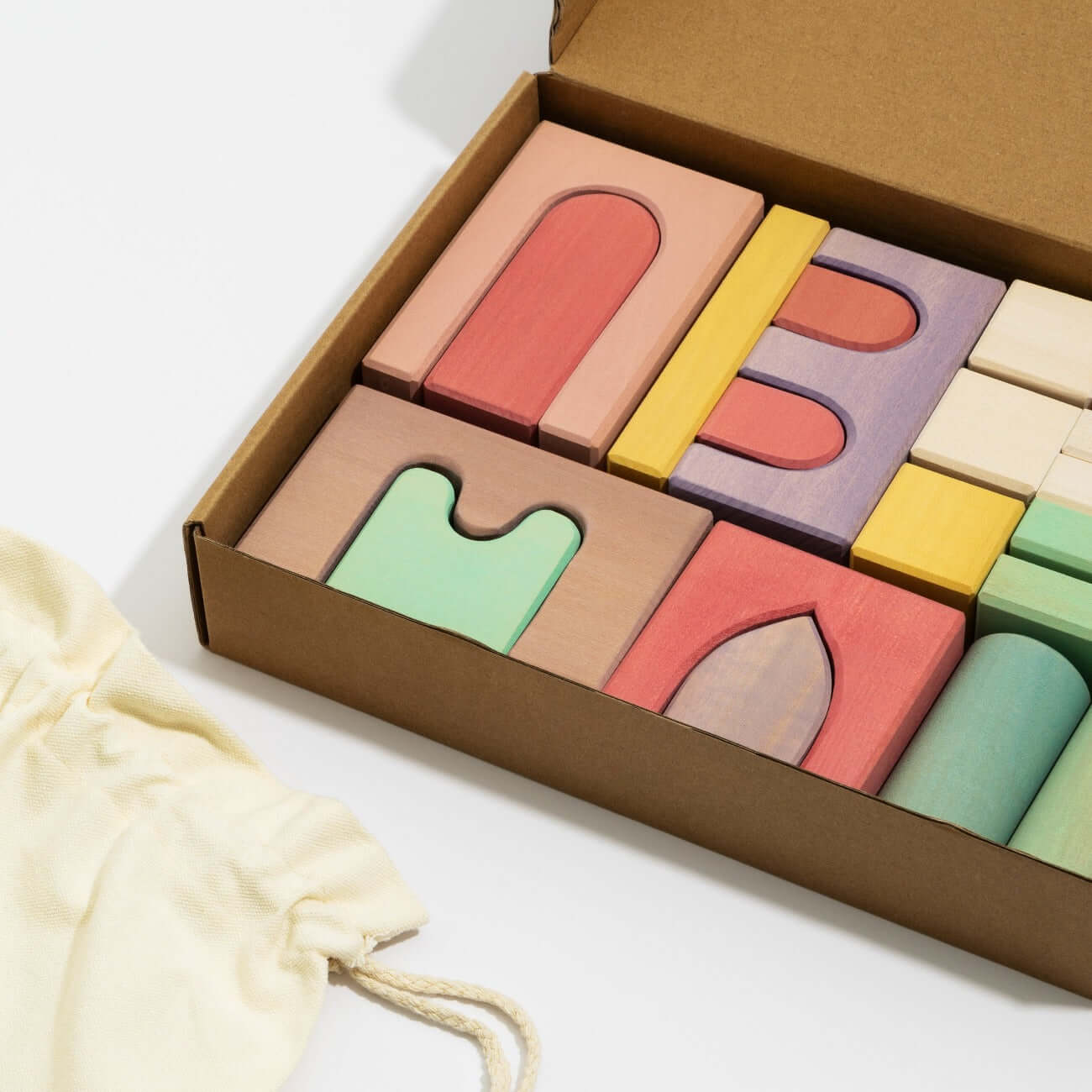 Alt Tag: Karen Building Blocks wooden set in gift box with colorful arches, tunnels and shapes, non-toxic painted lime wood