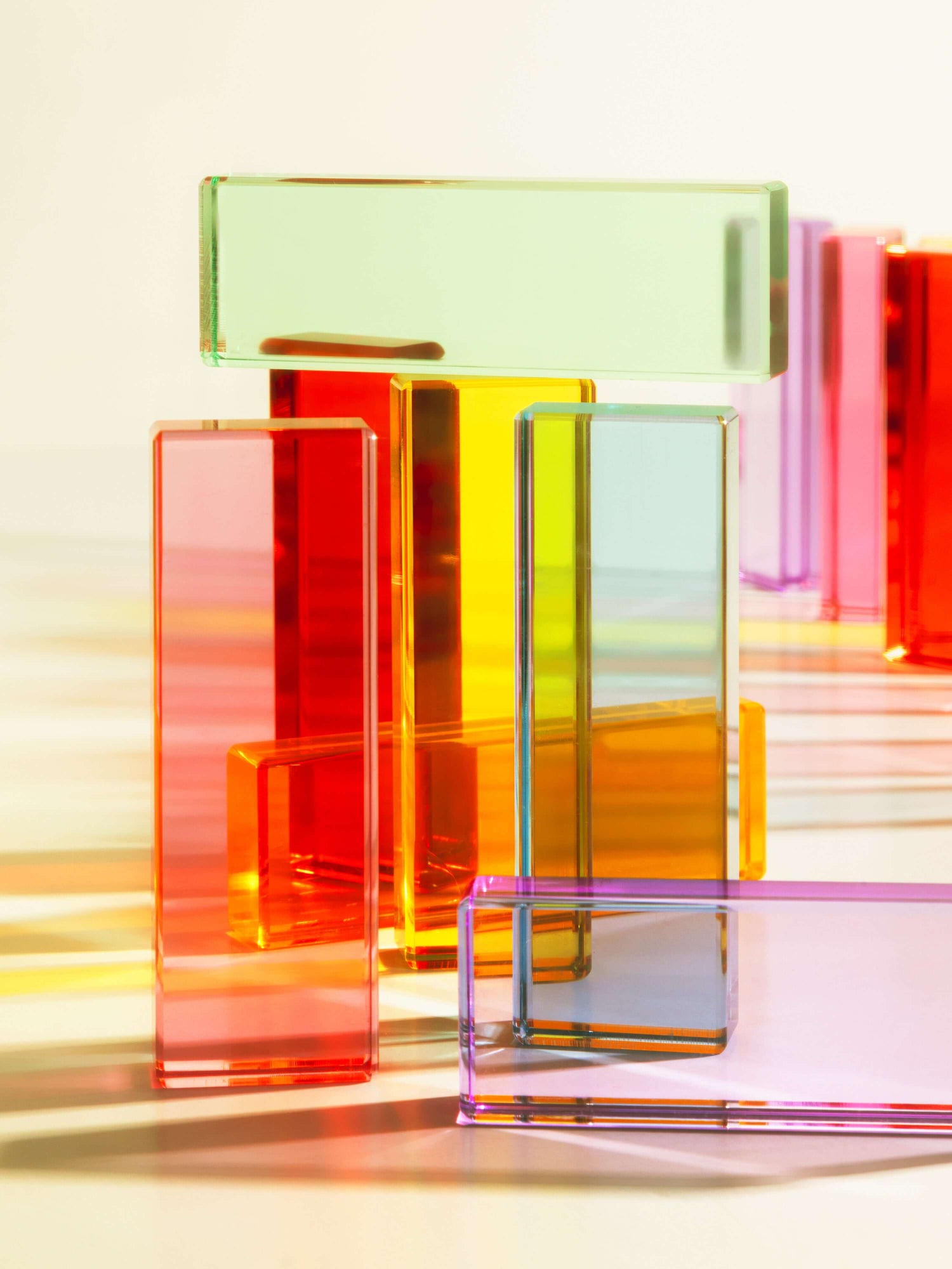 Illume Tower acrylic stacking blocks in vibrant colors creating a playful and dynamic building experience.