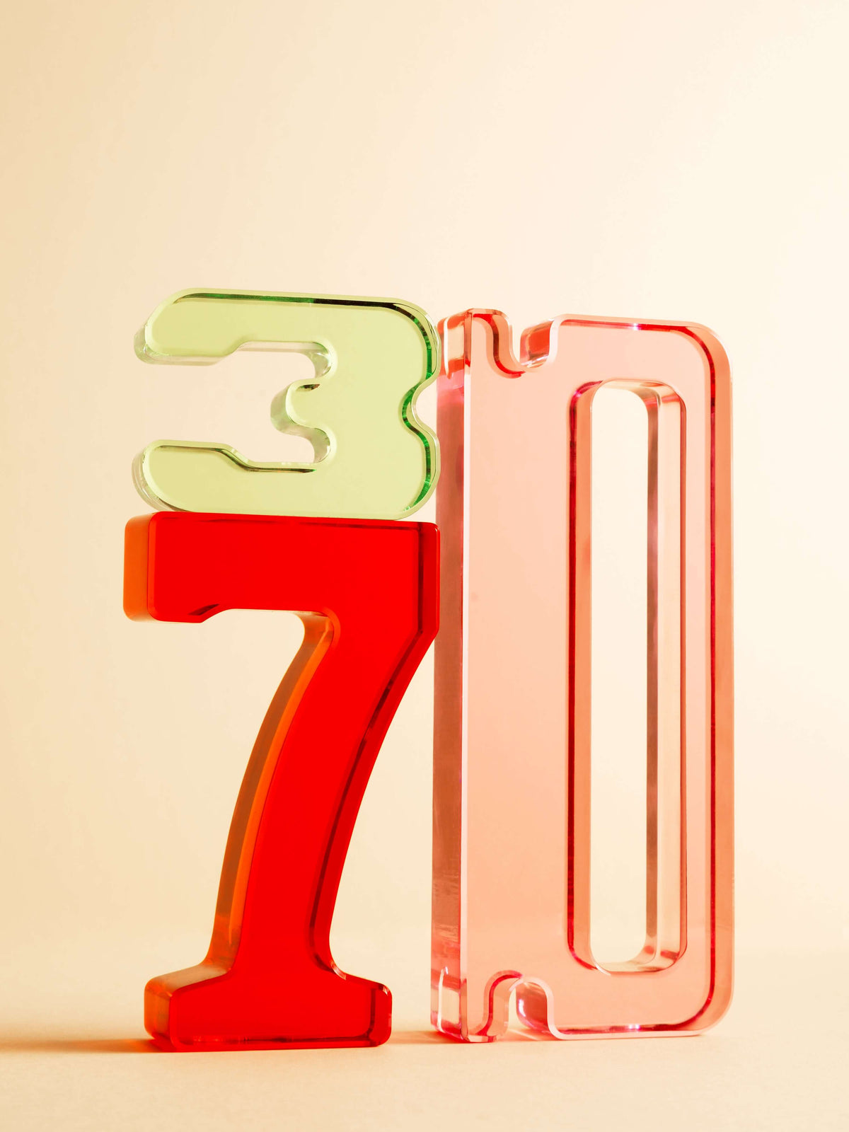 Colorful acrylic Number Blocks featuring 3, 7, and 0, ideal for early math learning and hands-on play.