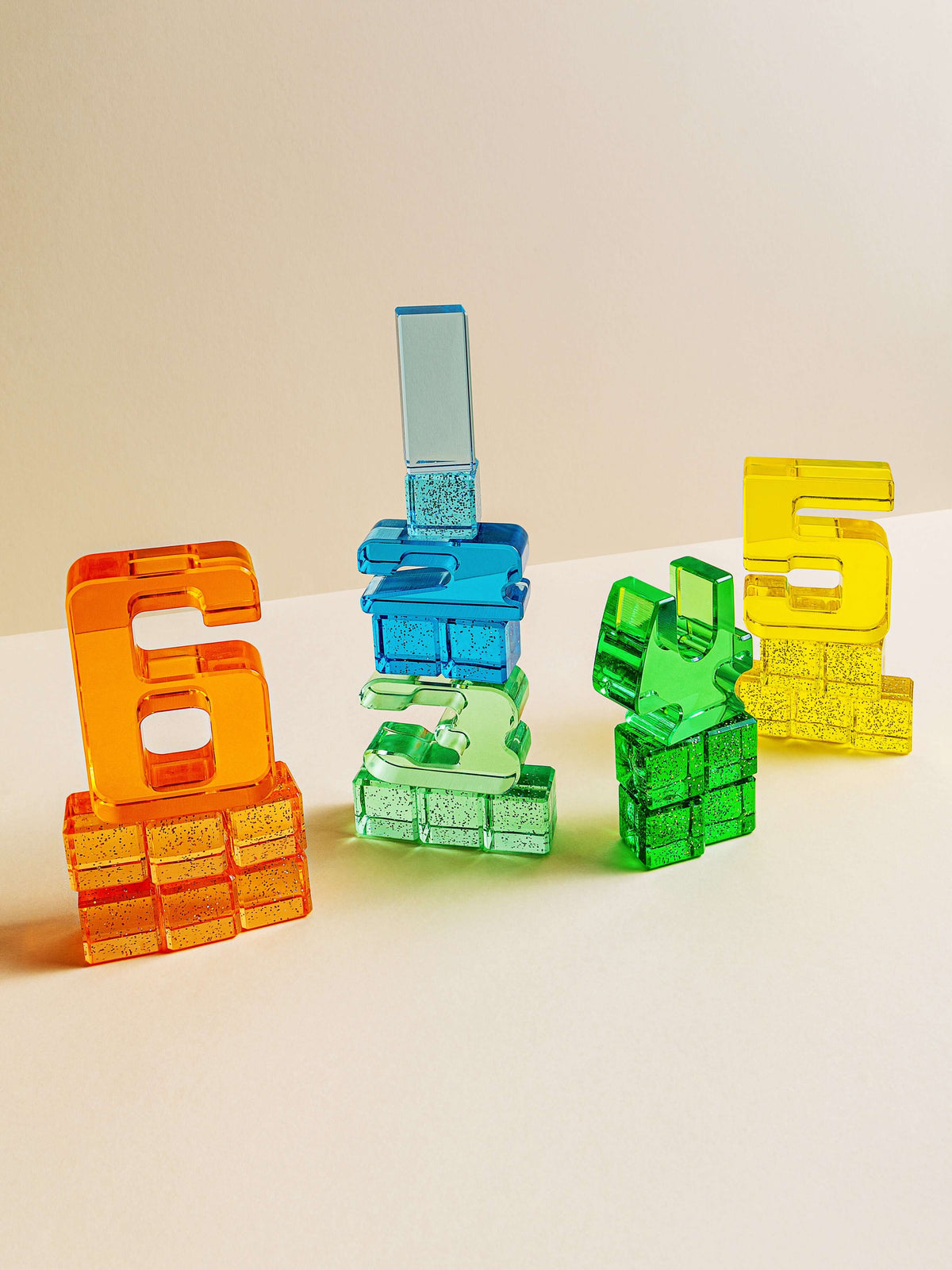 Colorful acrylic Number Blocks 6, 5, 4, 3, and 1 arranged visually to represent numbers and sizes for early math learning.