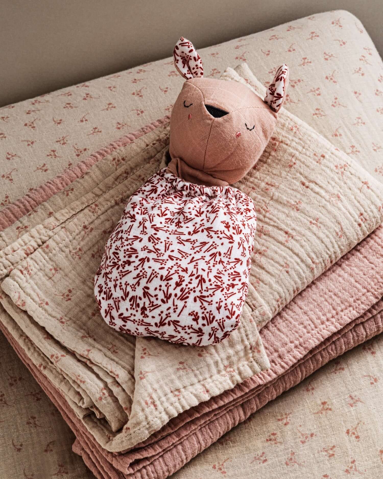 Pocket Pals organic cotton squirrel lovey comforter with fern print pouch, soft baby comfort toy on folded blanket
