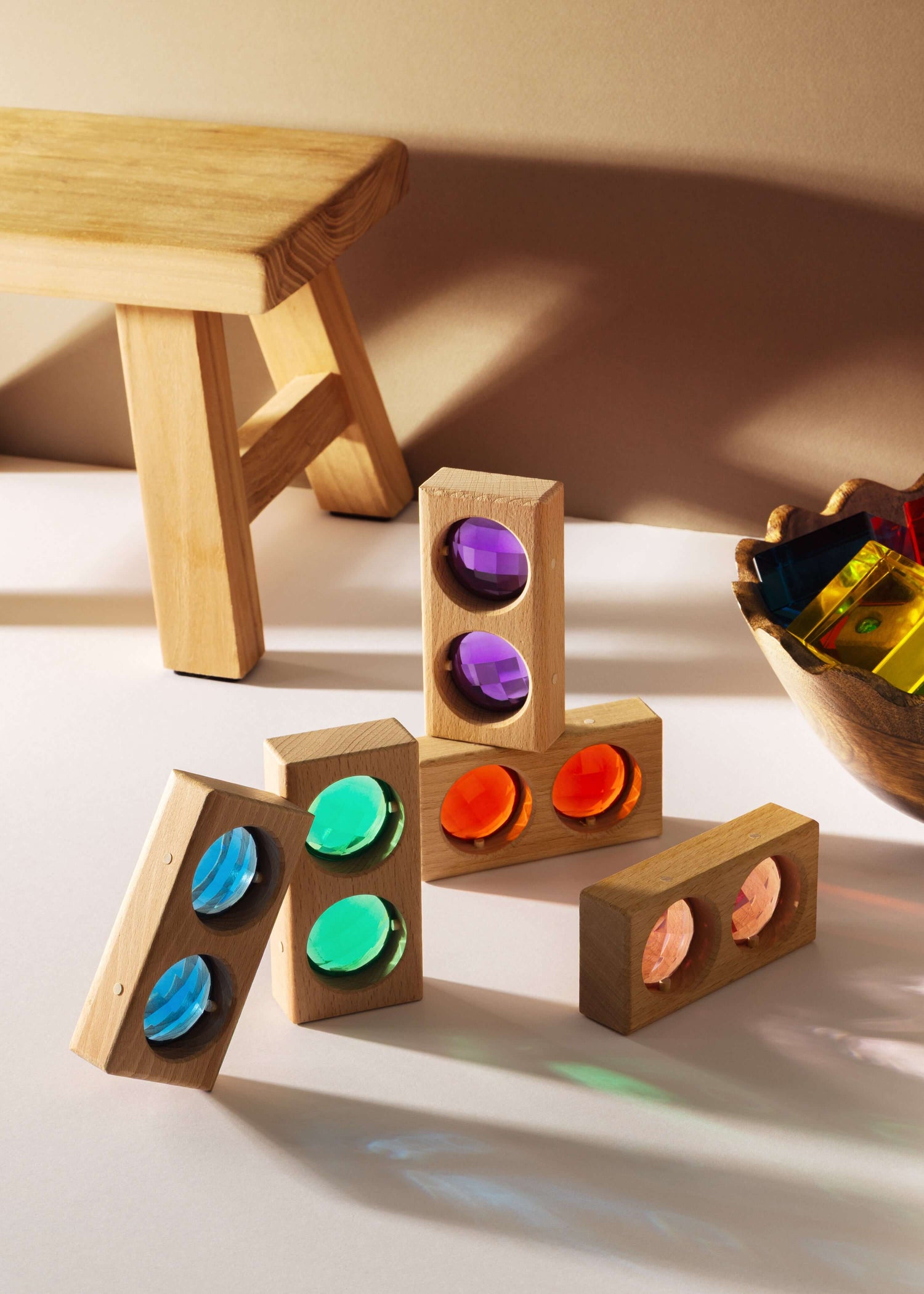 Juni Blocks - Rainbow Window Set with wooden blocks and colorful translucent acrylic inserts for imaginative play.