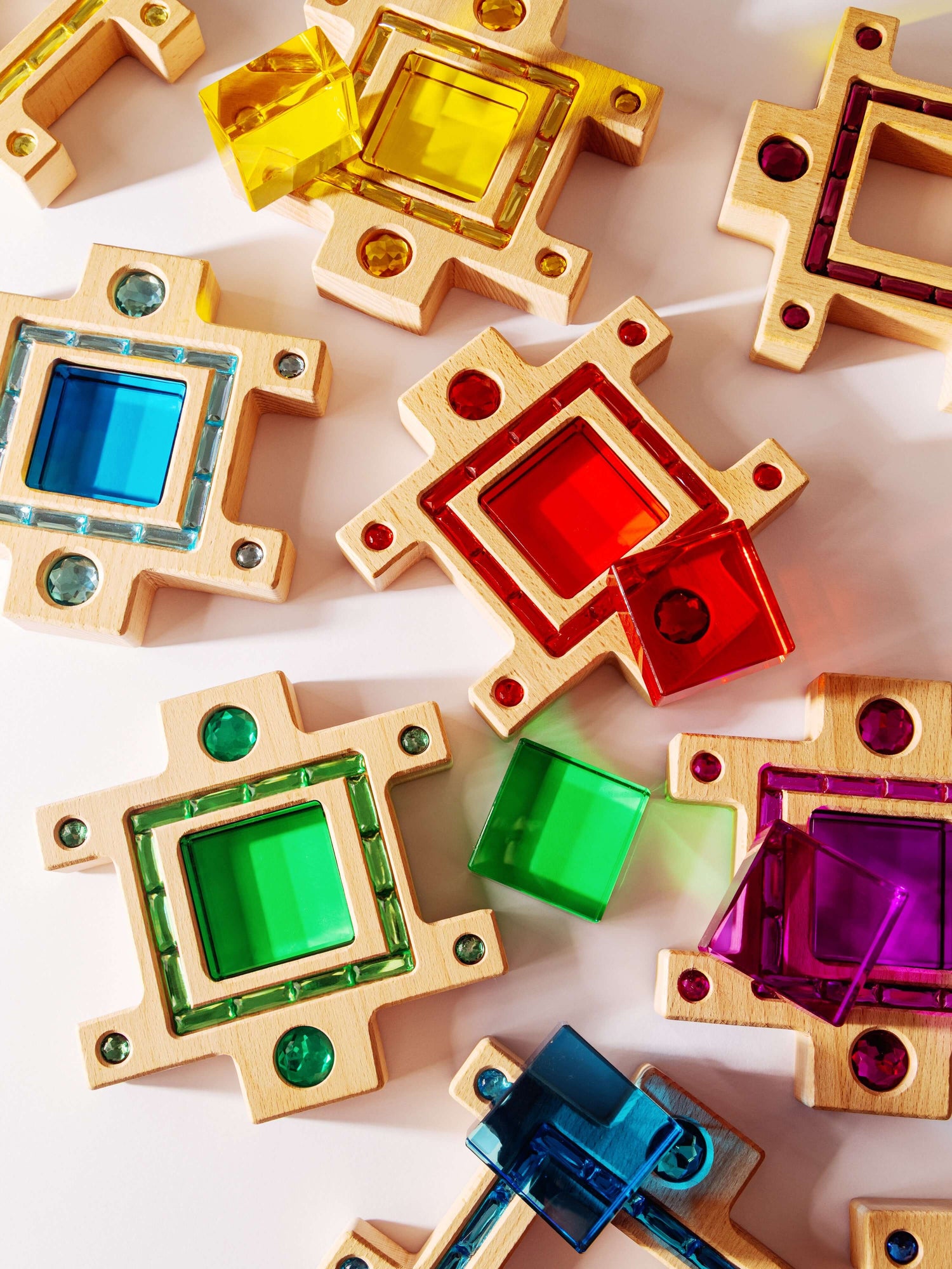 Busy Blocks wooden building set with colorful gem-like acrylic inlays and interlocking shapes for open-ended kids play