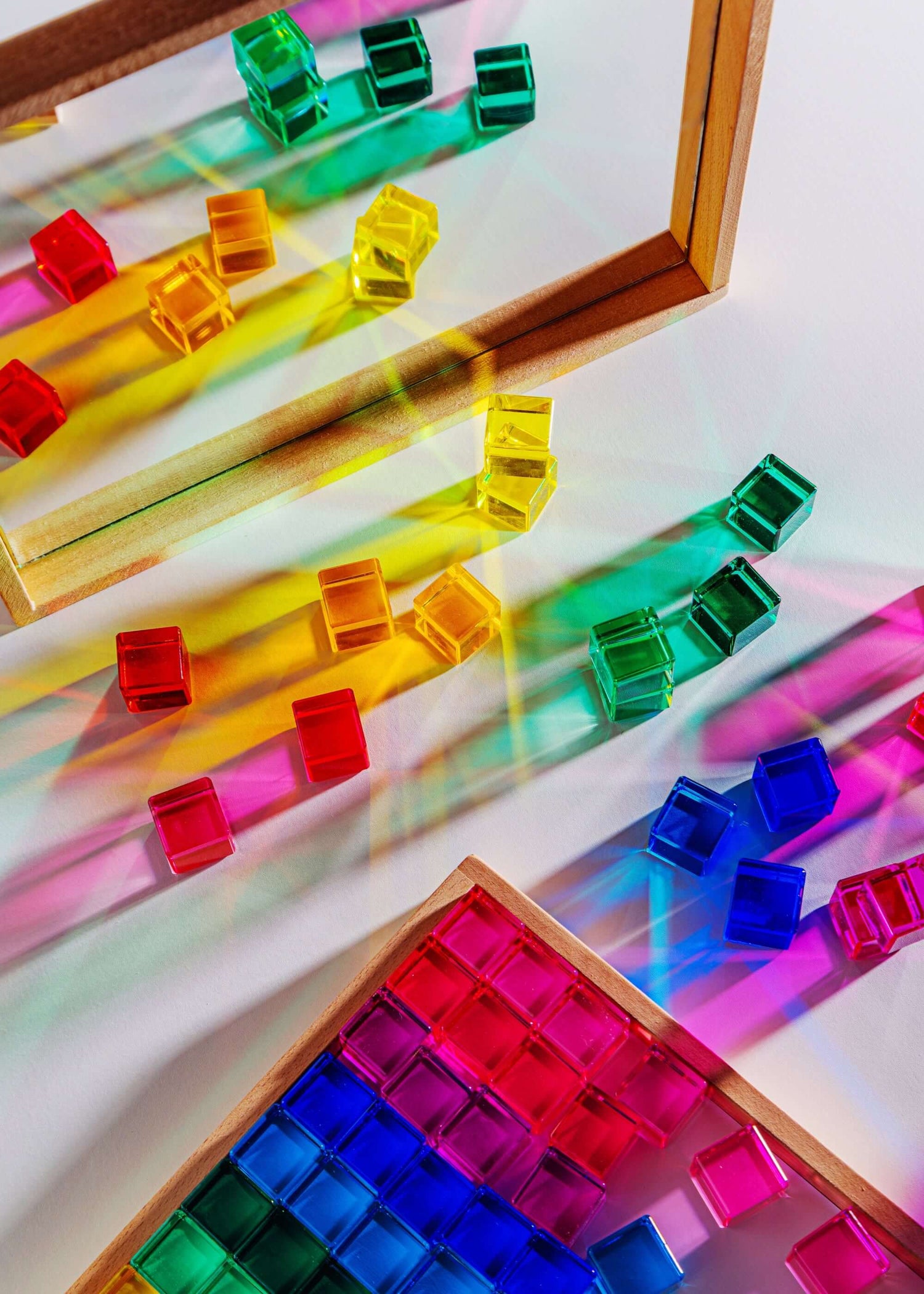 Mirror Tray showcasing colorful acrylic blocks reflecting vibrant light and shadows.
