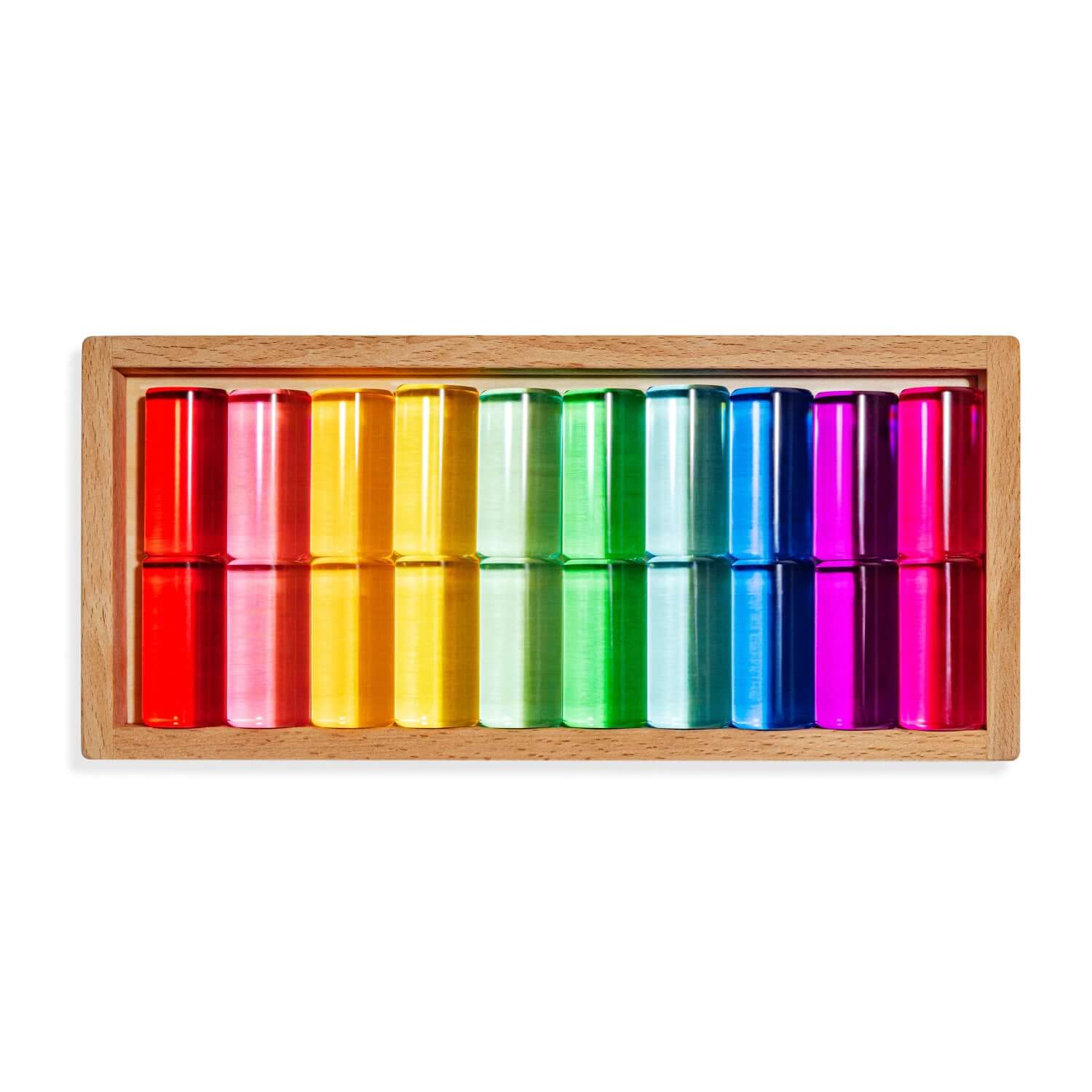 Colorful cylindrical blocks in a wooden box on a white background