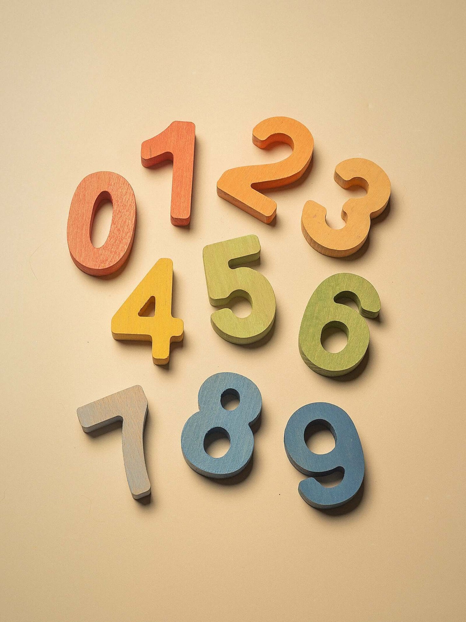 Colorful wooden numbers for early math, featuring digits 0-9. Perfect for learning with a Wooden numbers puzzle for early math.