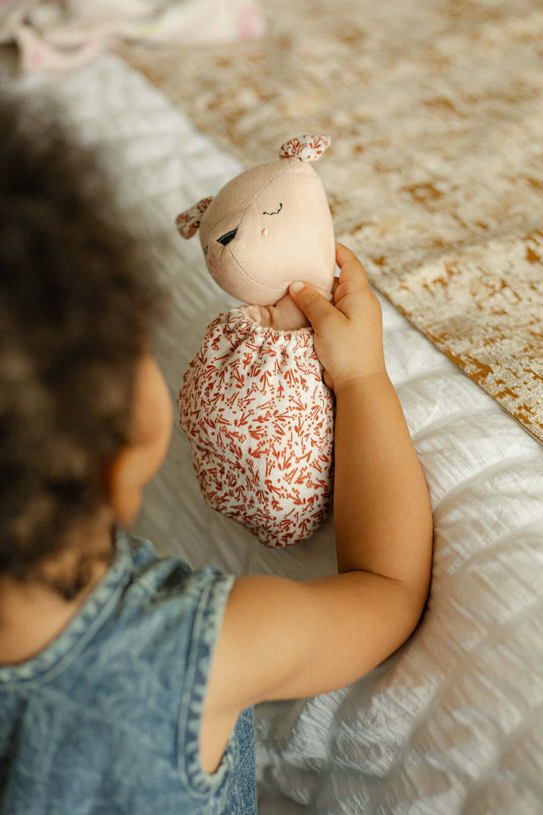 Pocket Pals organic cotton squirrel lovey comforter with contrast fern print pouch, toddler holding soft baby comfort toy