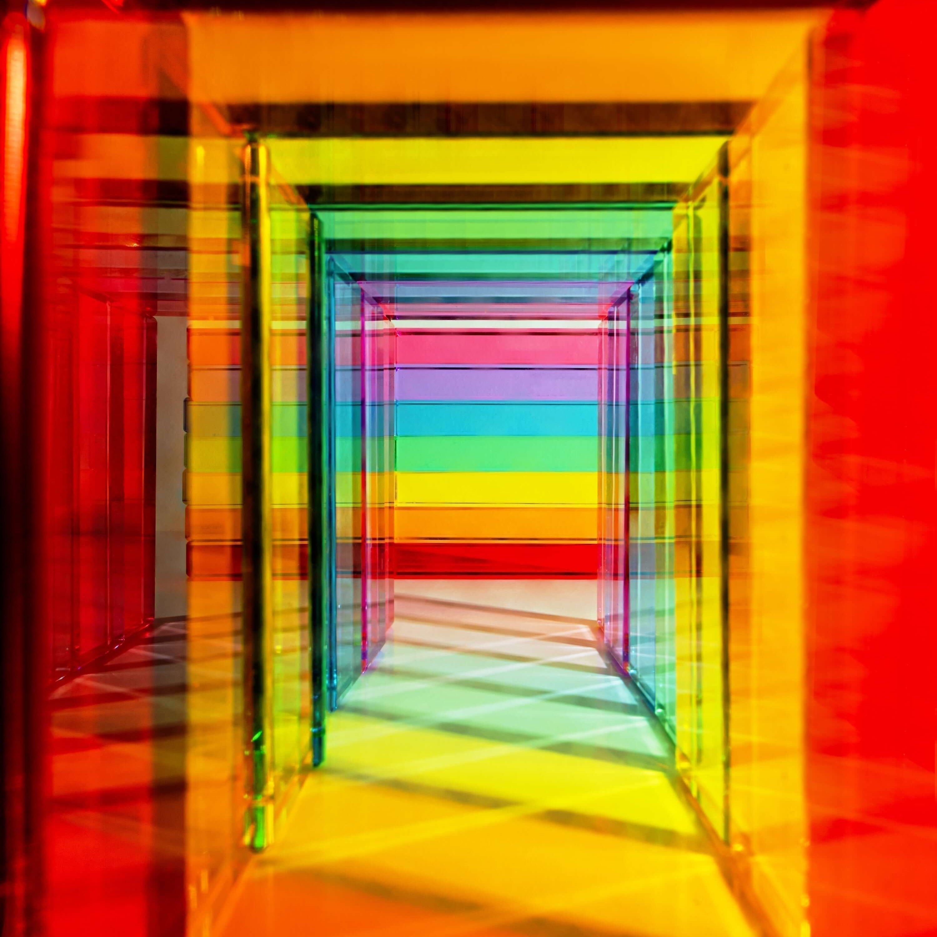 Colorful transparent blocks creating a vibrant geometric pattern representing CPSIA & CPC Certification in toy safety.
