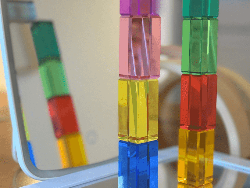 Exploring Reflections and Symmetry with Lucite Cubes