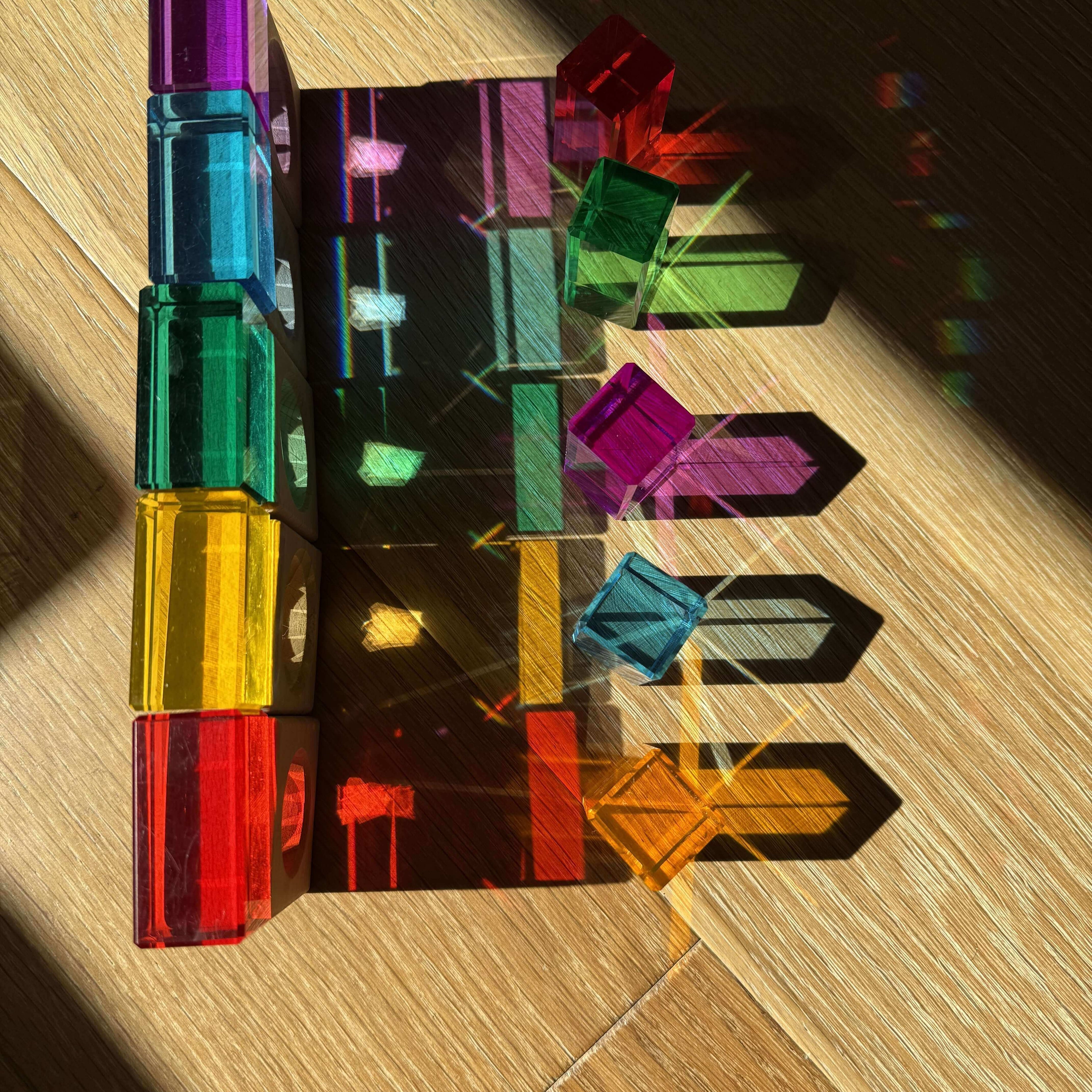 rainbow stem activity for kids using acrylic cubes refracting sunlight into rainbow shadows