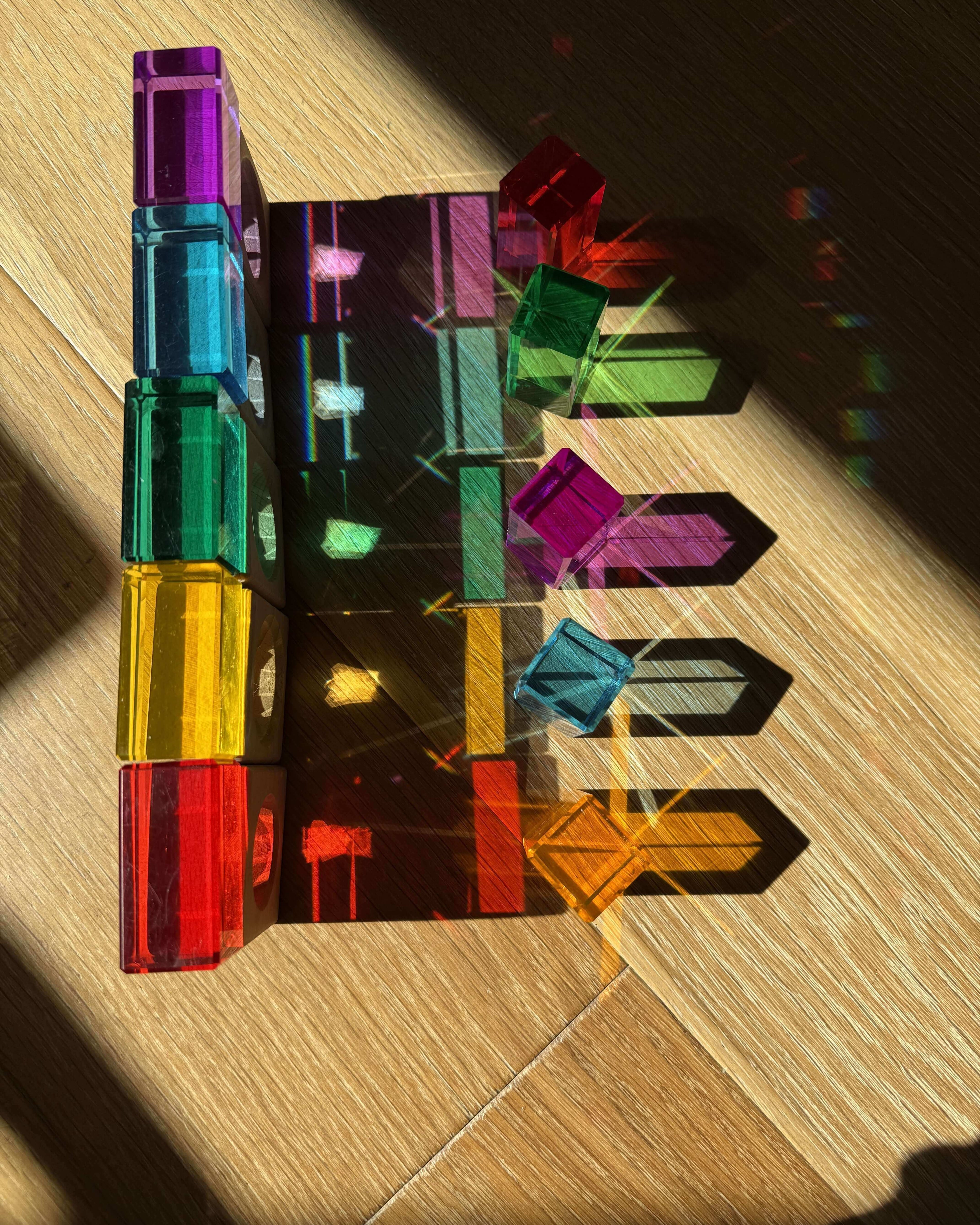 rainbow stem activity for kids using acrylic cubes refracting sunlight into rainbow shadows