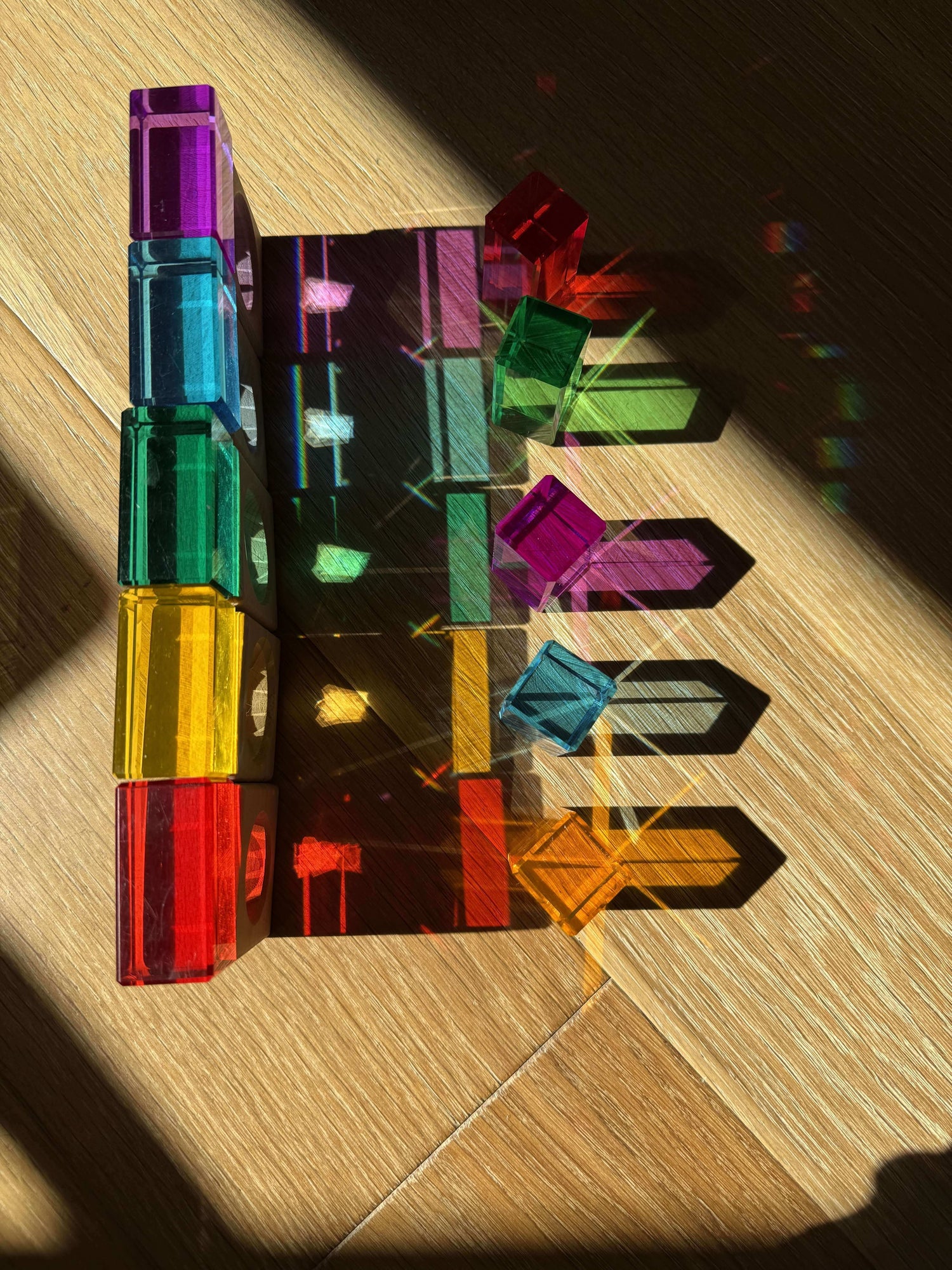 rainbow stem activity for kids using acrylic cubes refracting sunlight into rainbow shadows