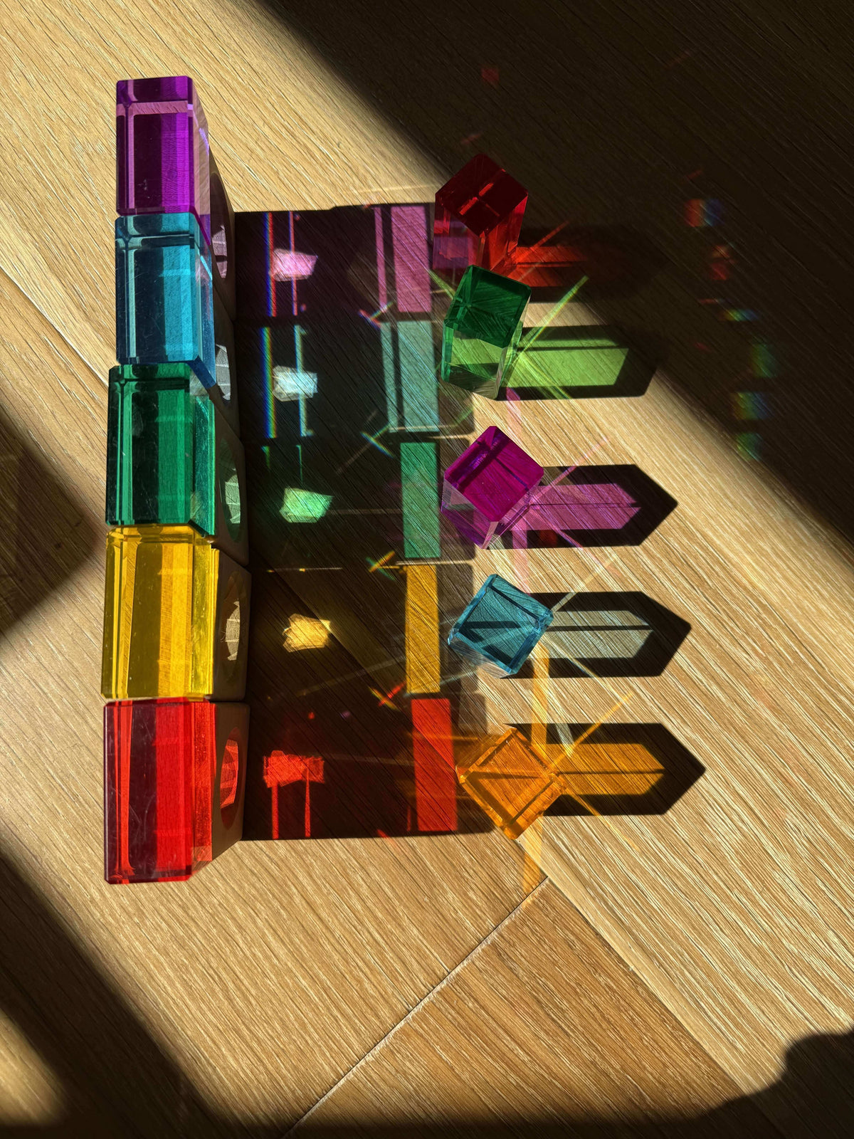 rainbow stem activity for kids using acrylic cubes refracting sunlight into rainbow shadows