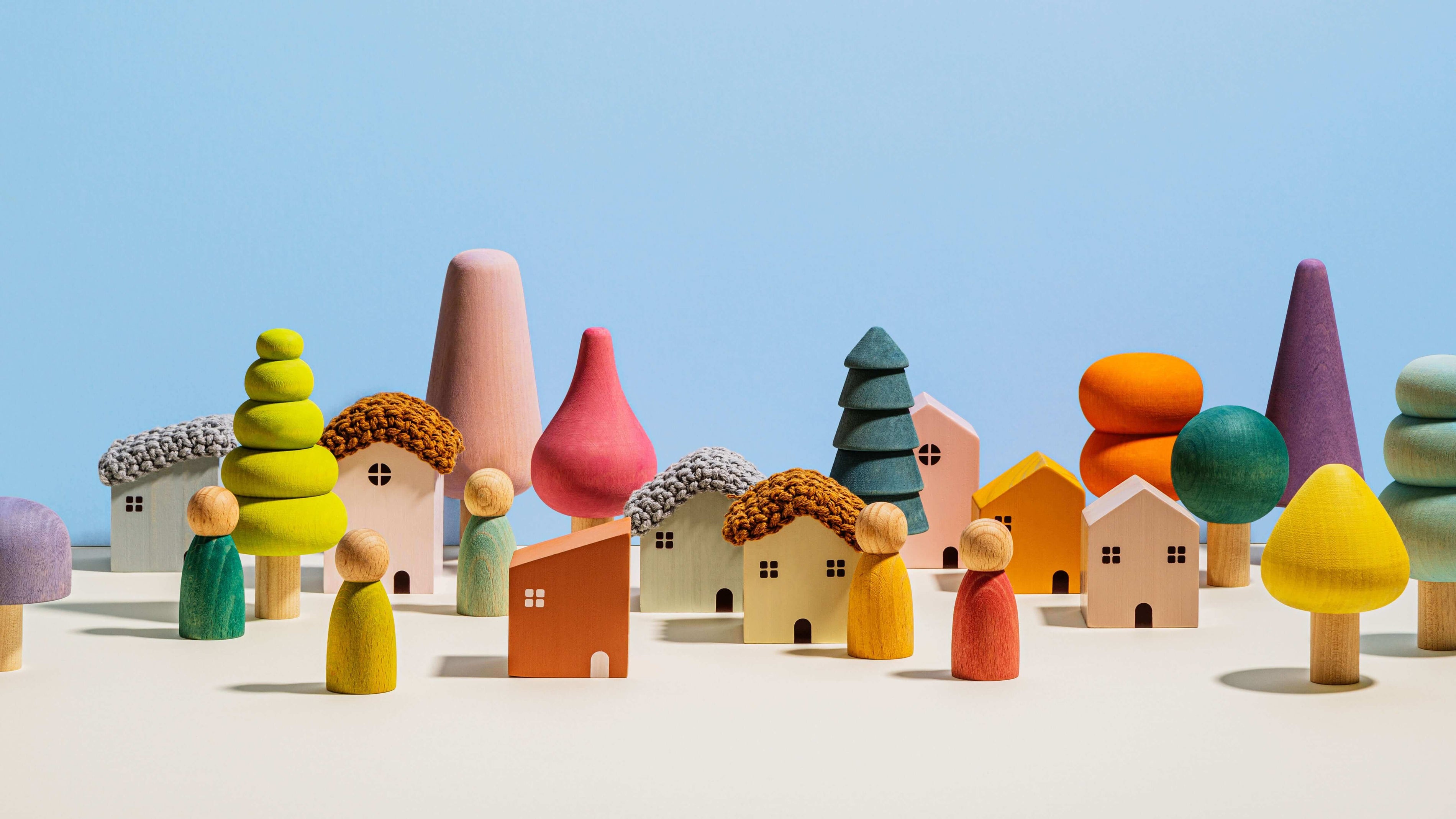 Colorful wooden blocks and peg dolls for imaginative play