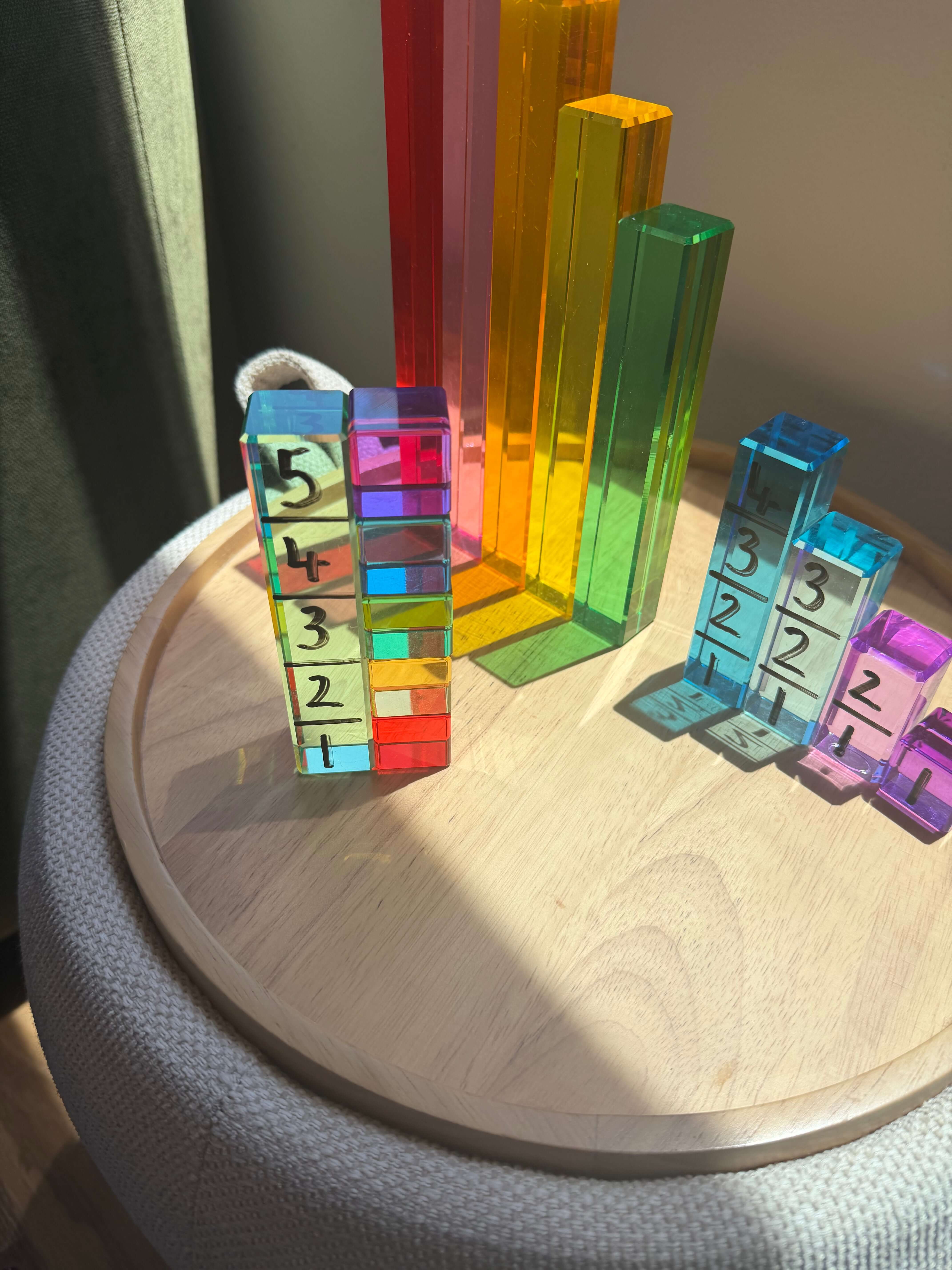 Colorful unit blocks arranged on a side table for a Unit Block Activity for Toddlers.