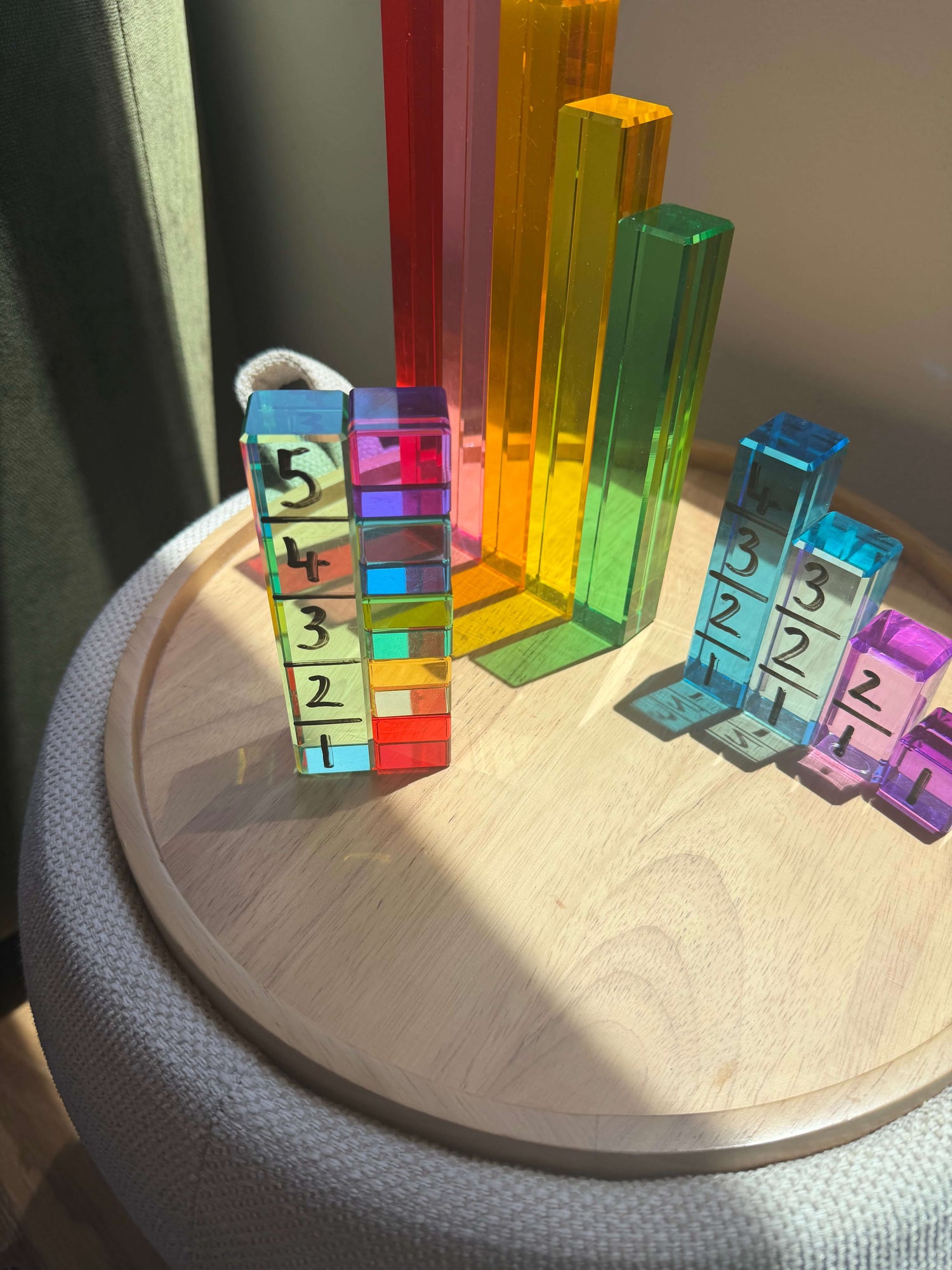 Colorful unit blocks arranged on a side table for a Unit Block Activity for Toddlers.