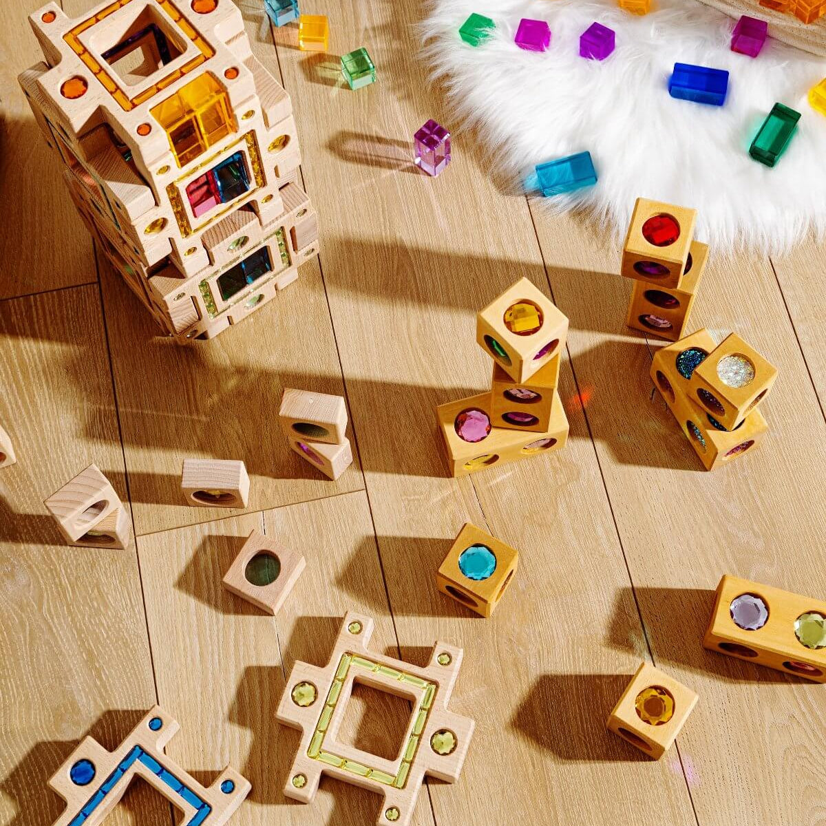 play-based learning guide showing open-ended blocks scattered in a playroom