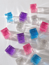 Colorful cosmic cube acrylic glitter blocks creating prismatic light effects.