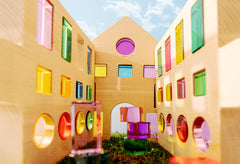Creative Builder Set showcasing colorful modular walls and transparent blocks against a blue sky.