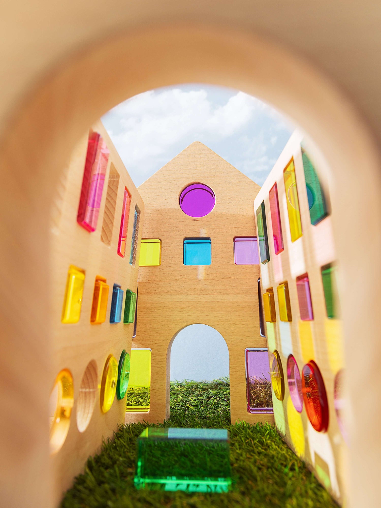 Interior view of the Rêve House Set modular wooden building set showcasing vibrant colored panels.