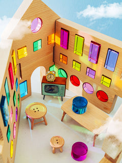 Rêve House Set modular wooden building set interior showcasing colorful windows and furniture.