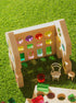 Rêve House Set modular wooden building set with colorful transparent windows and mini furniture on green grass.