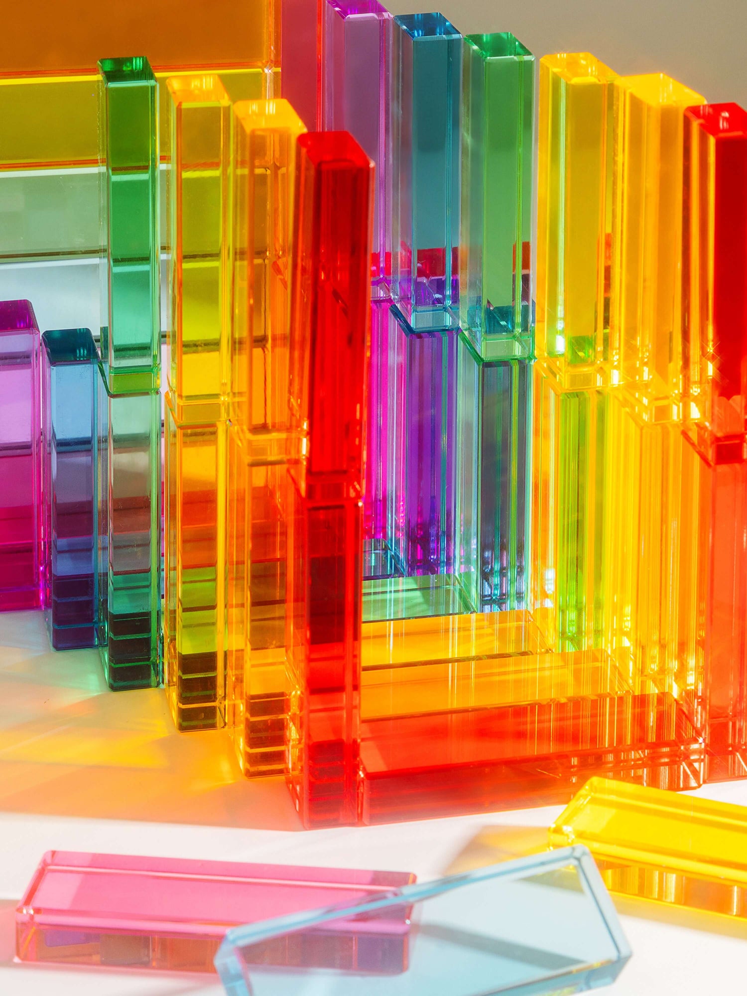 Illume Tower acrylic stacking blocks in vibrant colors, perfect for creative play and light exploration.