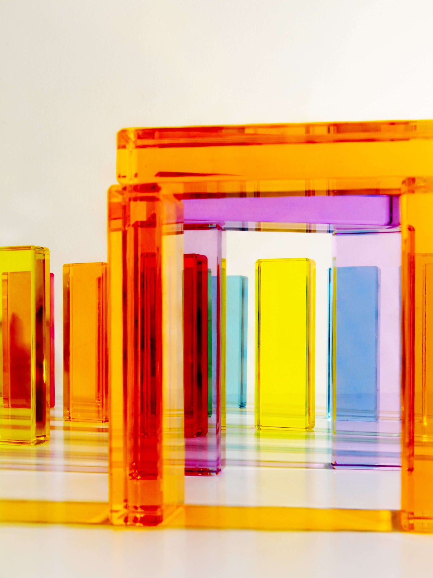 Illume Tower acrylic stacking blocks showcasing vibrant colors and translucent design for creative play.