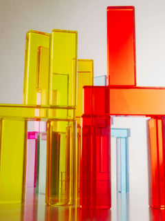 Illume Tower acrylic stacking blocks in bright colors, showcasing light reflection and sensory play.