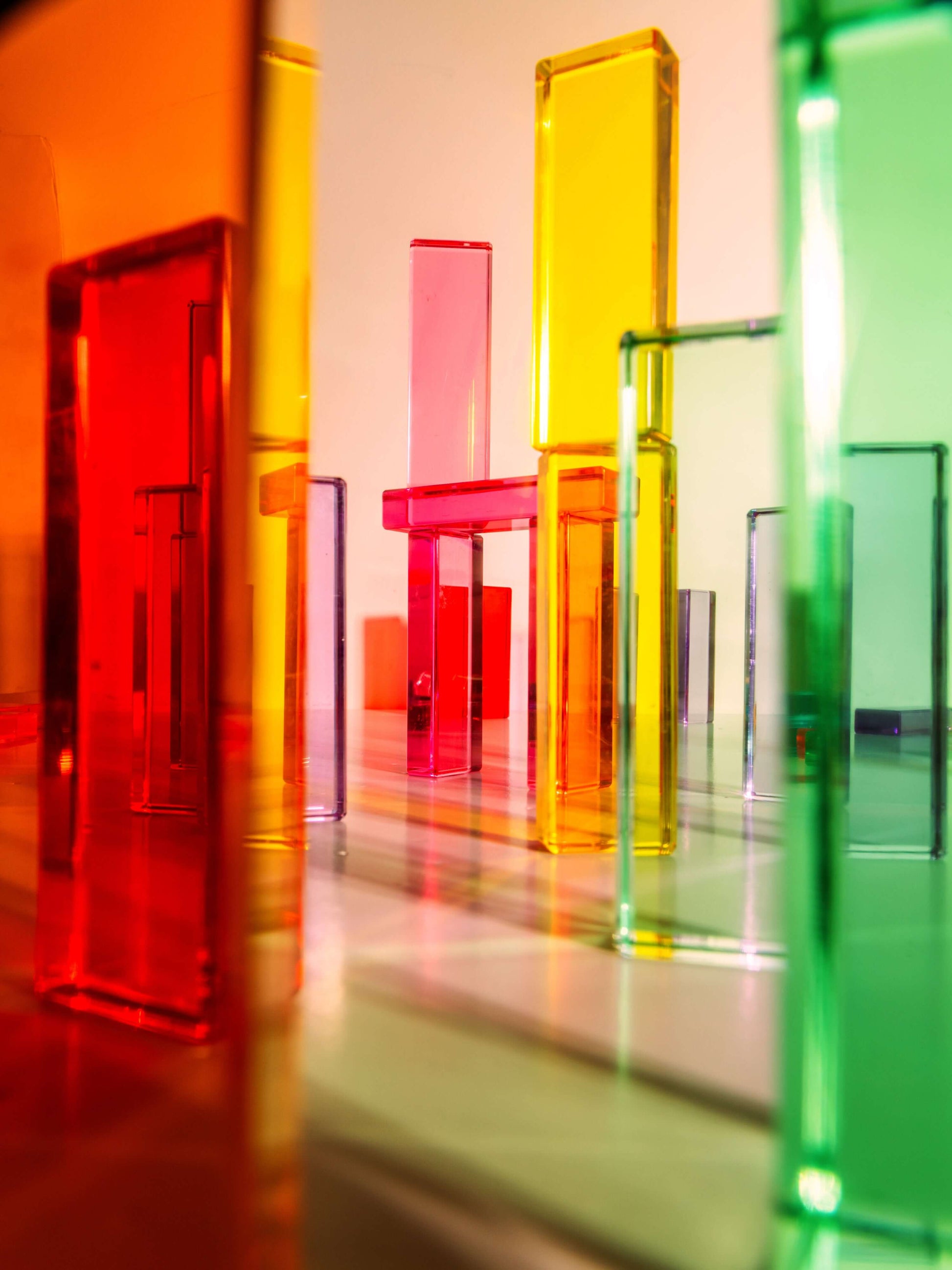 Colorful Illume Tower acrylic stacking blocks in various shapes creating a dynamic play environment.