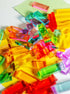 Colorful Illume Tower acrylic stacking blocks scattered on a surface, ready for creative play.