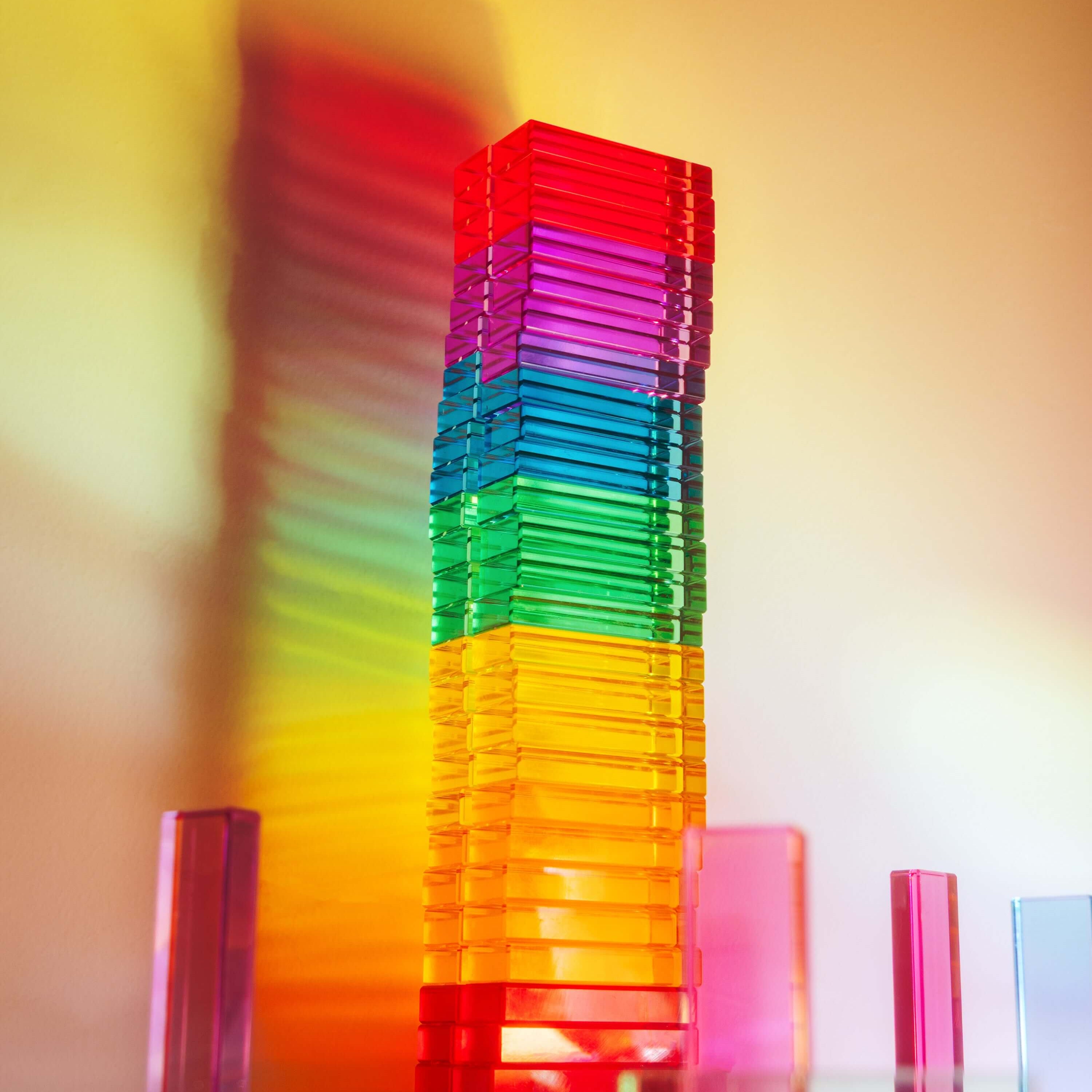 Illume Tower acrylic stacking blocks showcasing vibrant colors and light reflections.