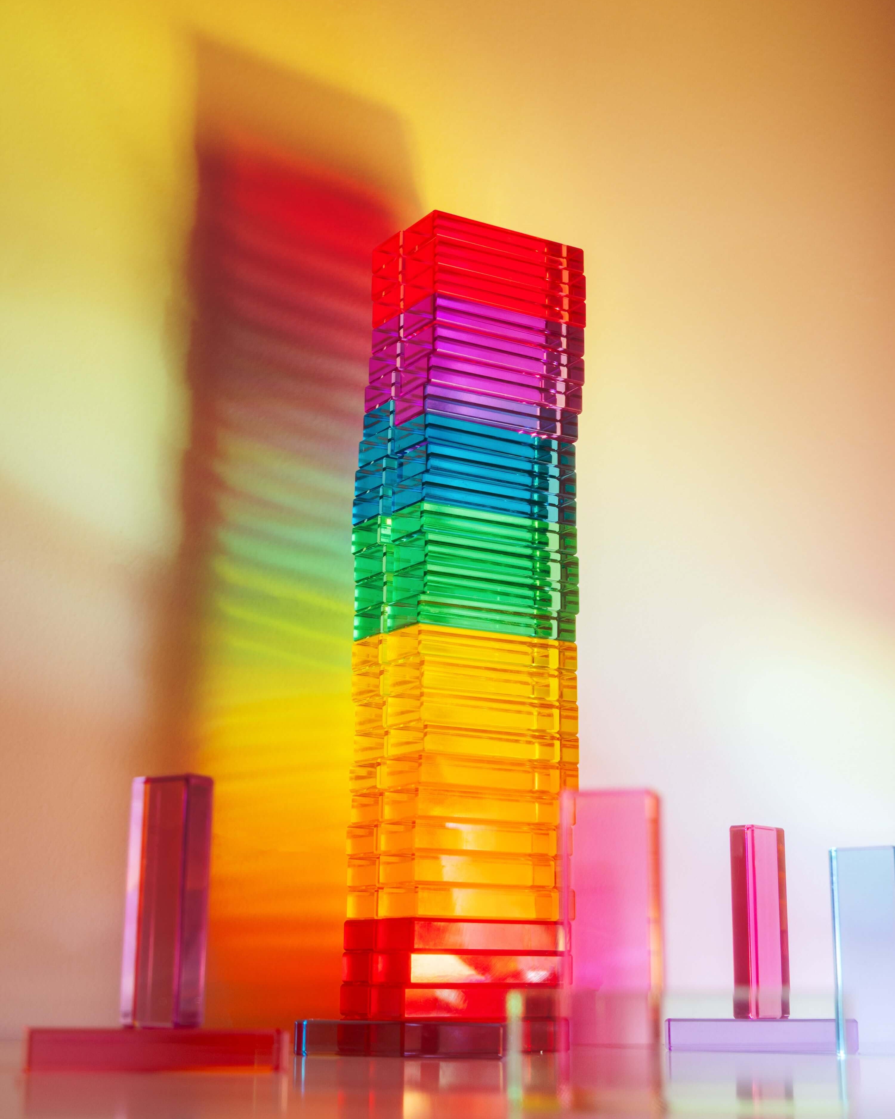 Illume Tower acrylic stacking blocks showcasing vibrant colors and light reflections.