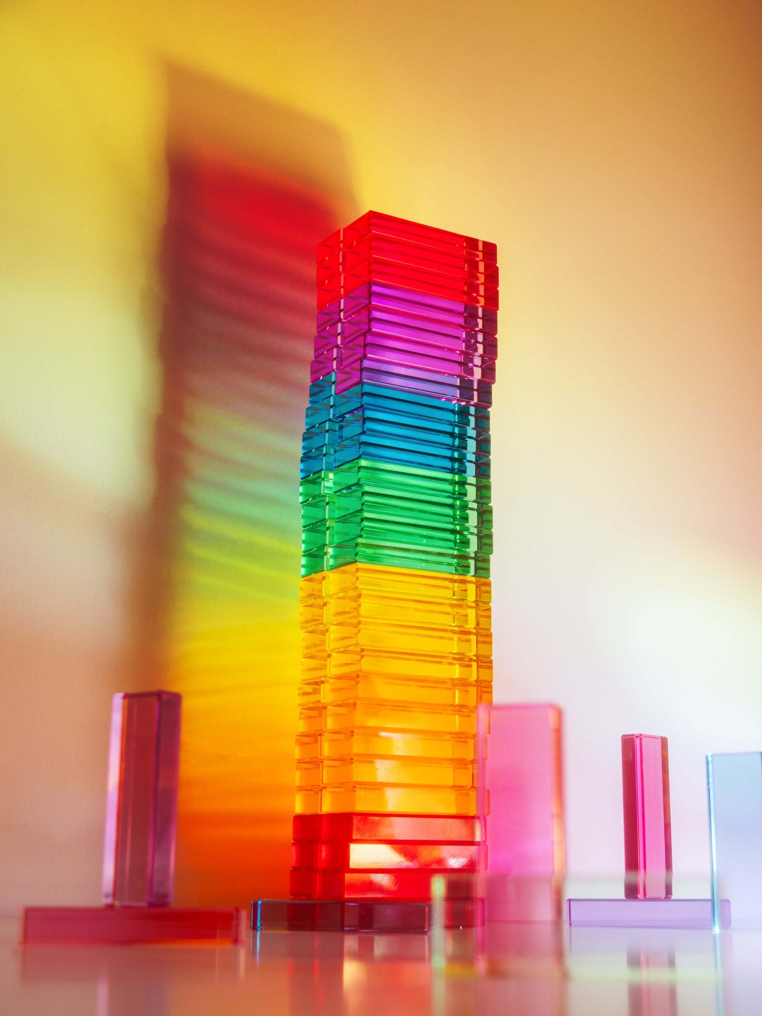 Illume Tower acrylic stacking blocks showcasing vibrant colors and light reflections.