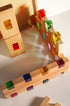 Fynn Set wooden building panels with colorful acrylic inserts, designed for creative play and structural exploration.
