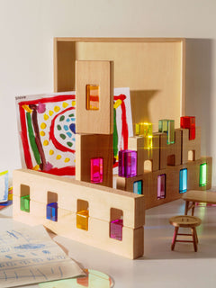 Fynn Set wooden building panels with colorful acrylic window inserts for creative play.