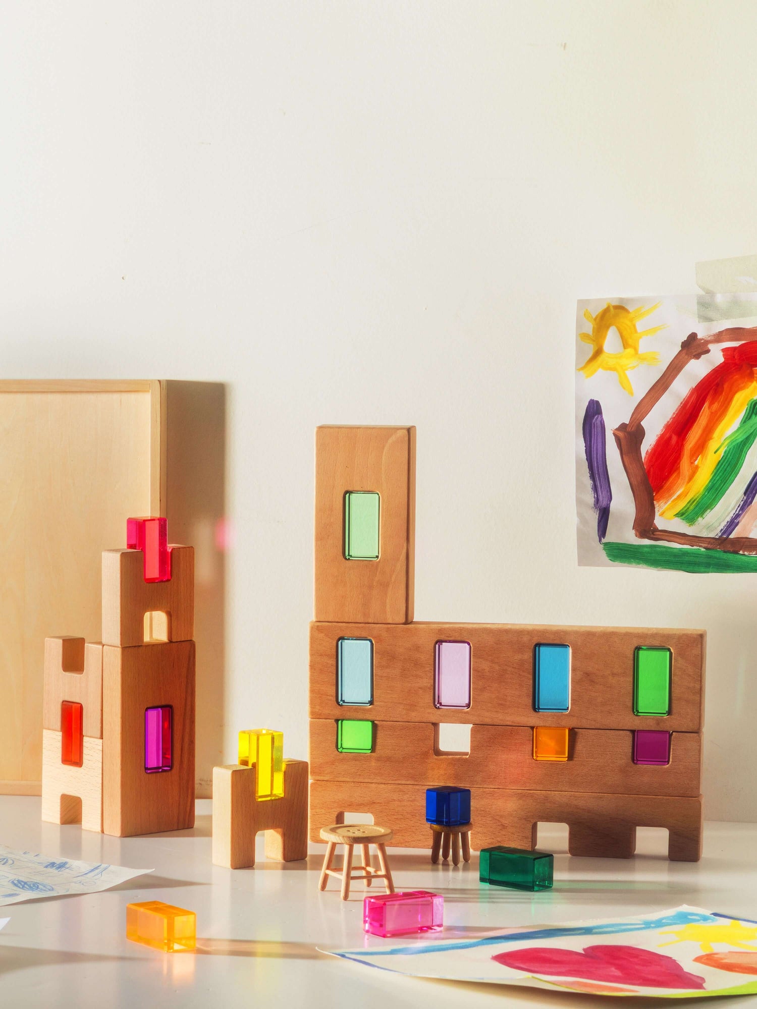 Fynn Set wooden building panels with removable acrylic inserts, colorful structures for open-ended play.