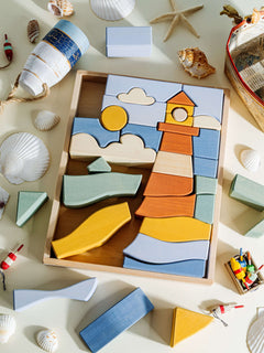 Byron Lighthouse Puzzle featuring a vibrant wooden lighthouse and coastal elements, promoting imaginative play.
