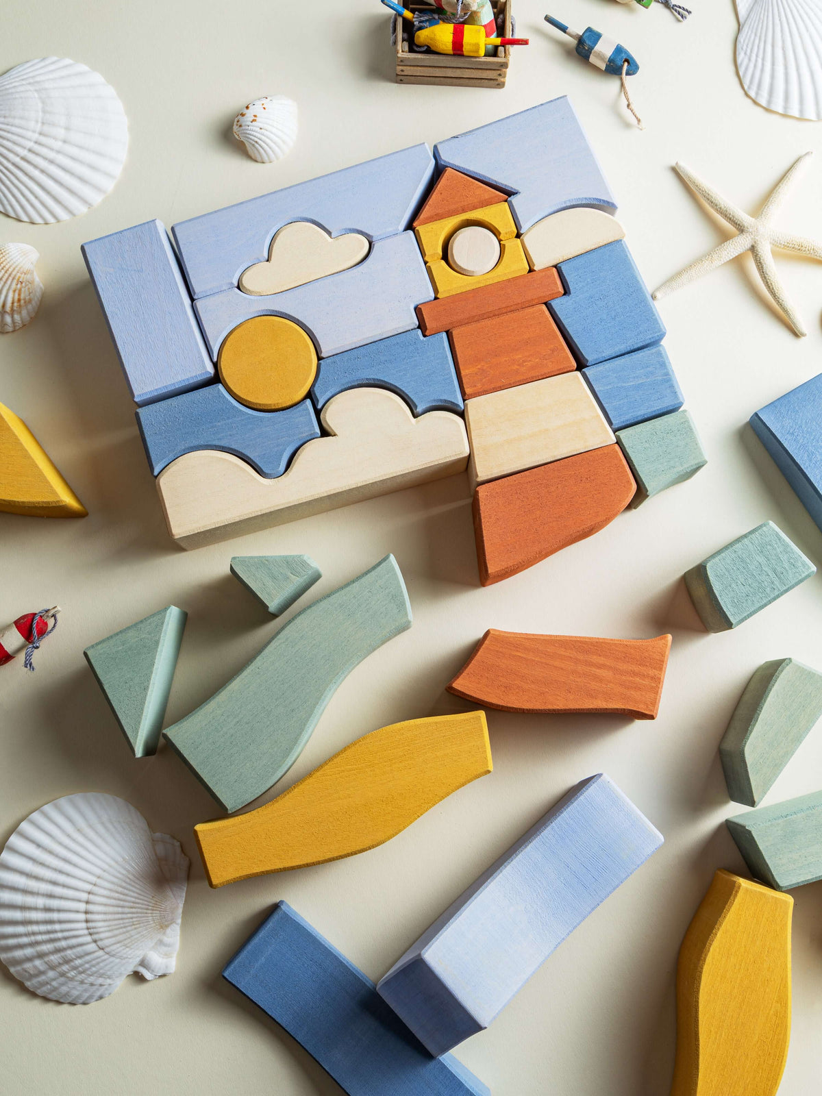 Byron Lighthouse Puzzle displayed with colorful pieces and coastal design, wooden blocks for imaginative play.