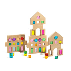 Rêve House Set modular wooden building set with colorful translucent windows and geometric shapes.