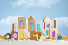 Laguna Block Set featuring beechwood blocks with colorful acrylic windows against a blue sky.