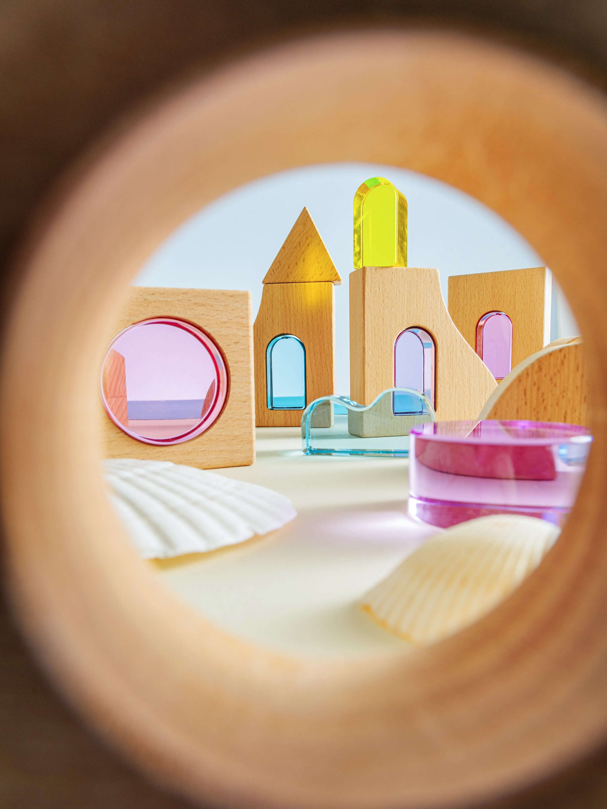 Laguna Block Set view through wooden structure showcasing colored acrylic and beechwood building pieces.