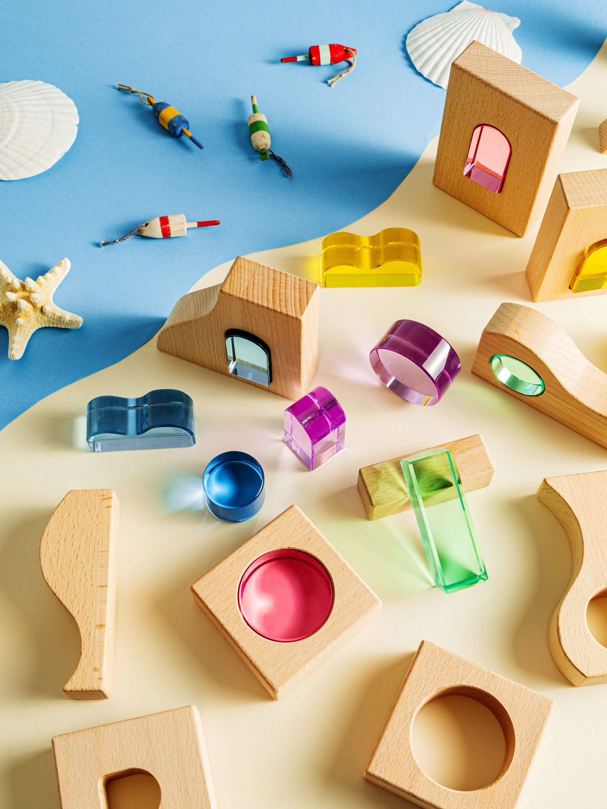 Laguna Block Set with colorful acrylic and natural beechwood shapes on a beach-inspired background.