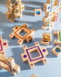 Colorful pieces of the grand building collection set laid out for play on a blue surface.