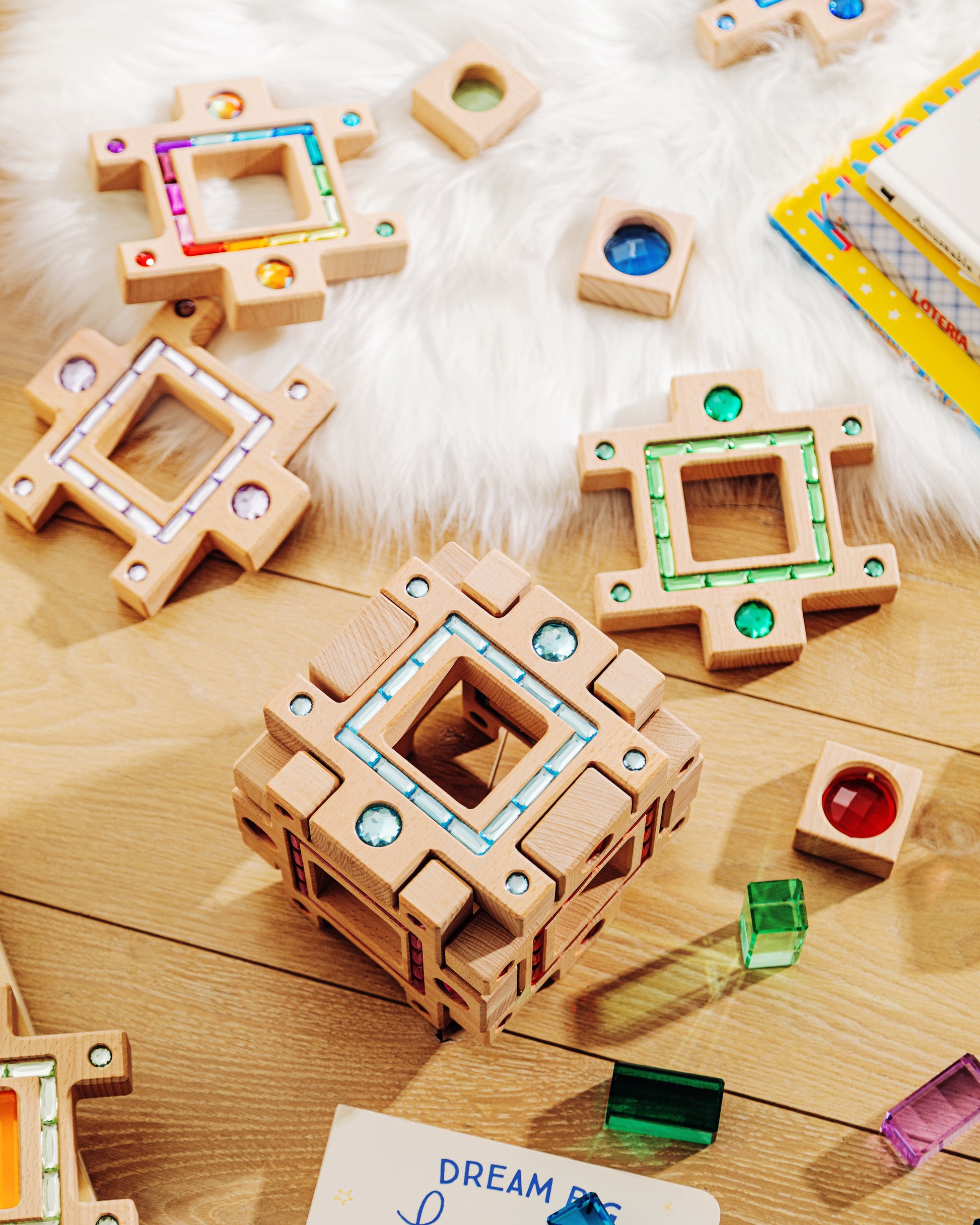 Colorful pieces of the grand building collection set arranged on a wooden surface, showcasing creative play and design.