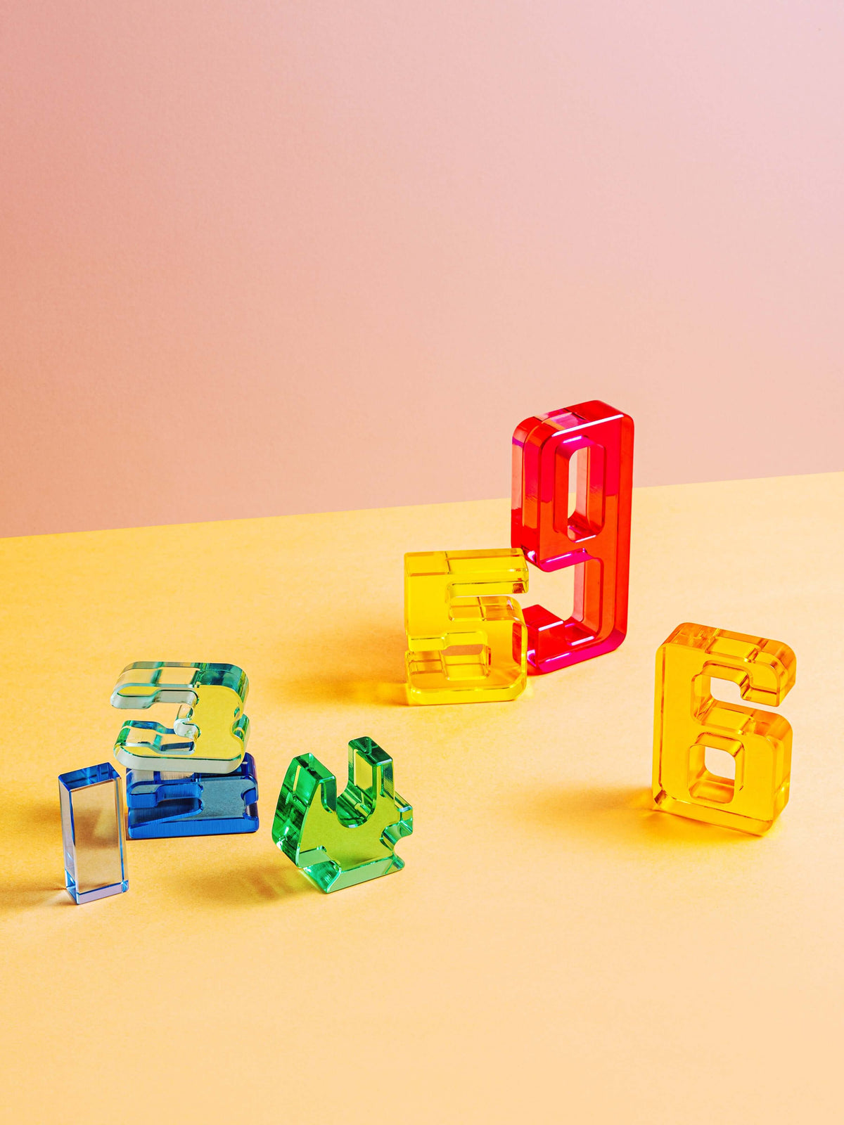 Colorful acrylic Number Blocks showing numerical values 3, 5, 6, and 9 for early math learning.