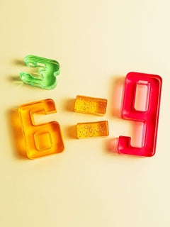 Colorful acrylic Number Blocks featuring numbers 3, 6, and 9 demonstrating mathematical relationships.