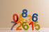 Colorful wooden numbers 0 to 8 arranged playfully, perfect for an educational puzzle set.