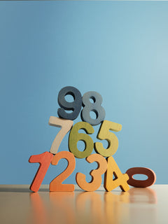 Colorful wooden numbers for kids' learning, part of the educational puzzle set for early childhood development.