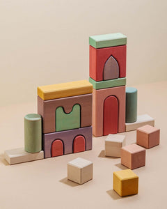 Alt Tag: Karen Building Blocks colorful wooden set stacked into modern towers and arches, non-toxic painted lime wood blocks